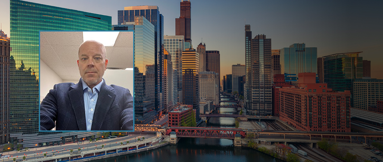 A view of a river flowing through the city with the Chicago skyline in the background